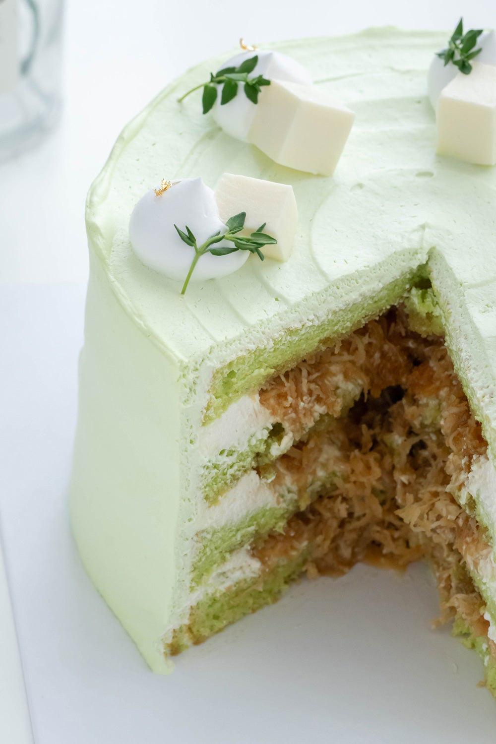Ondeh Ondeh Cake - Pandan Coconut Cake with Pandan Sponge Cake, Caramelized Gula Melaka, Fresh Coconut Flakes, Pandan Whipping Cream & Coconut Jelly Cubes Topping